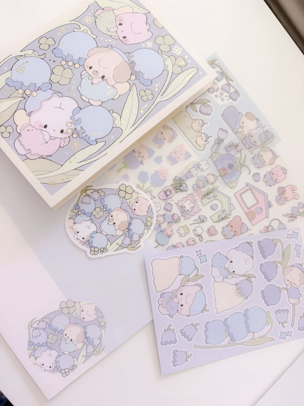 Set of cute animal-themed stationery items on a white surface