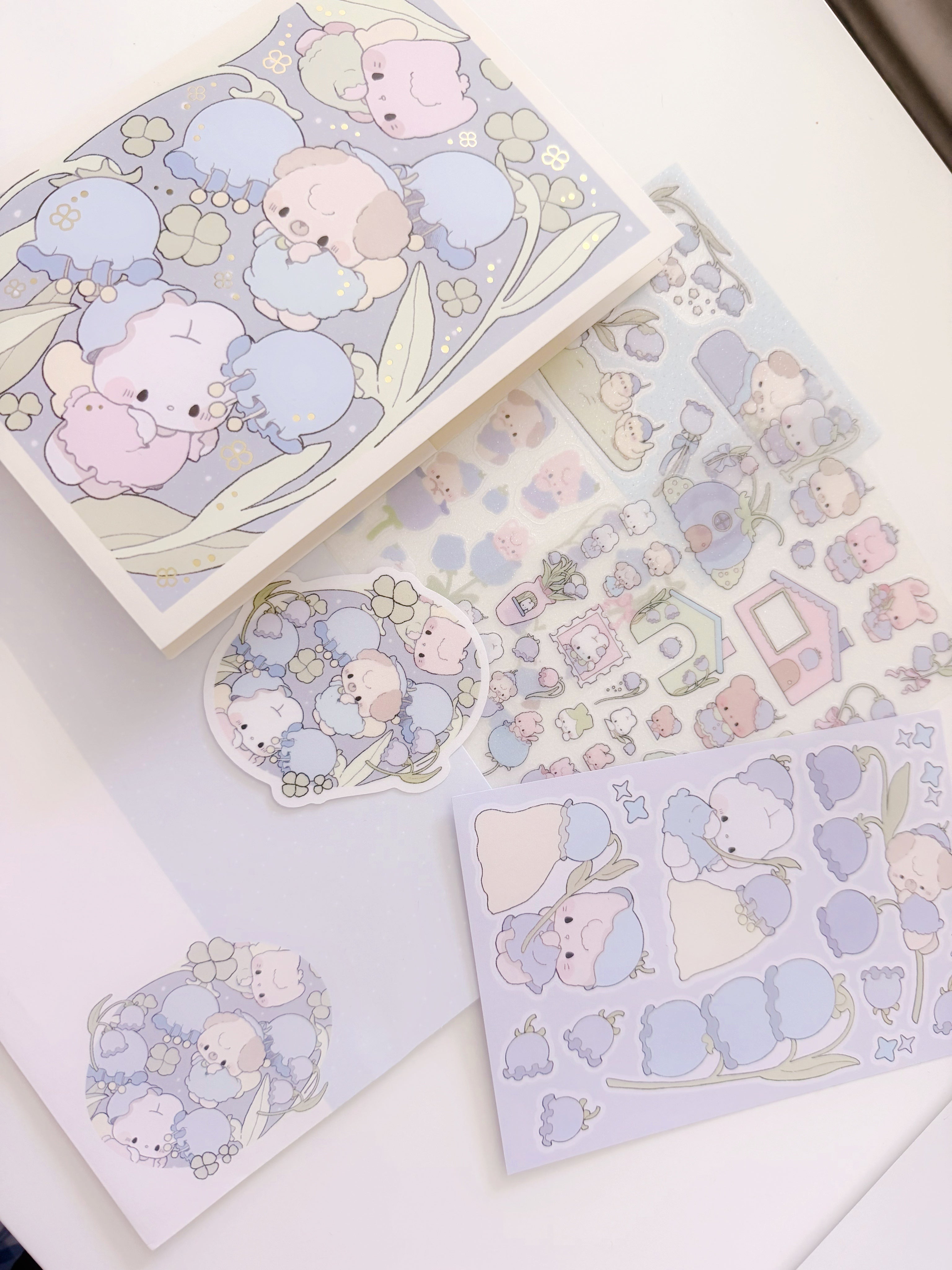 Set of cute animal-themed stationery items on a white surface