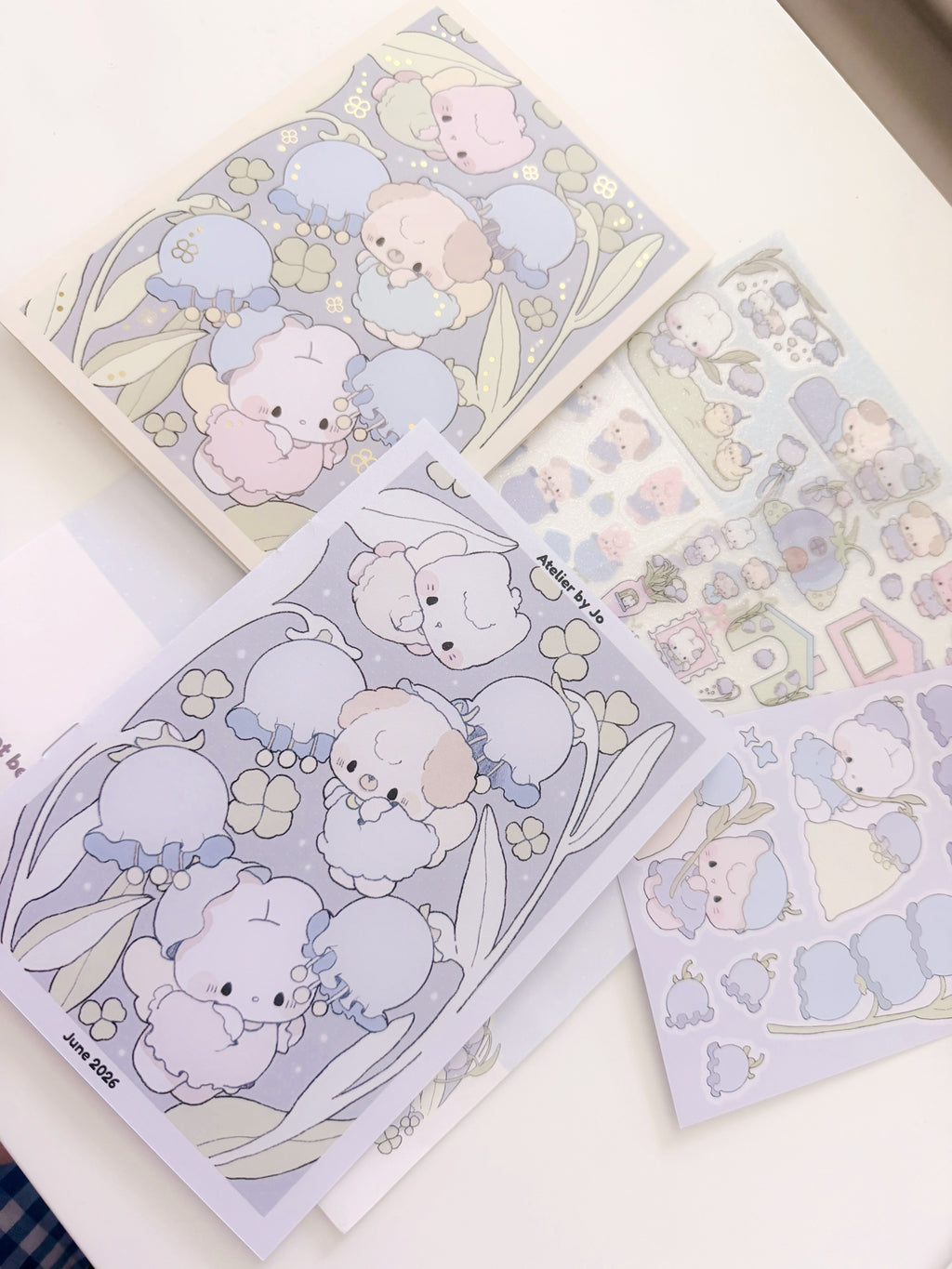Set of cute animal-themed stationery items on a white surface