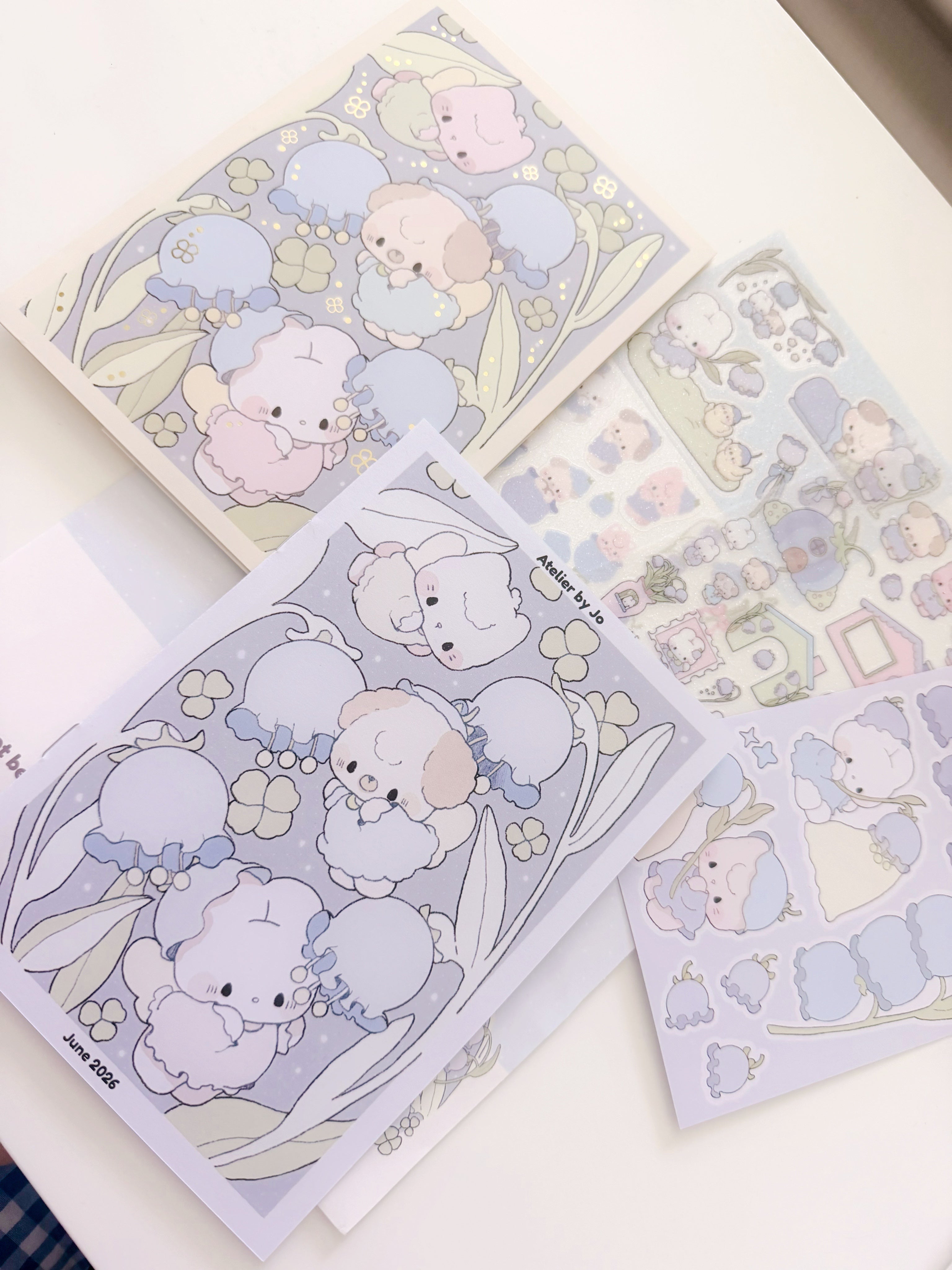 Set of cute animal-themed stationery items on a white surface