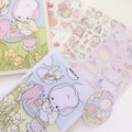 Set of cute illustrated stickers featuring cartoon characters and pastel colors on a white surface.