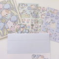 Set of stationery items with cute animal illustrations on a white background